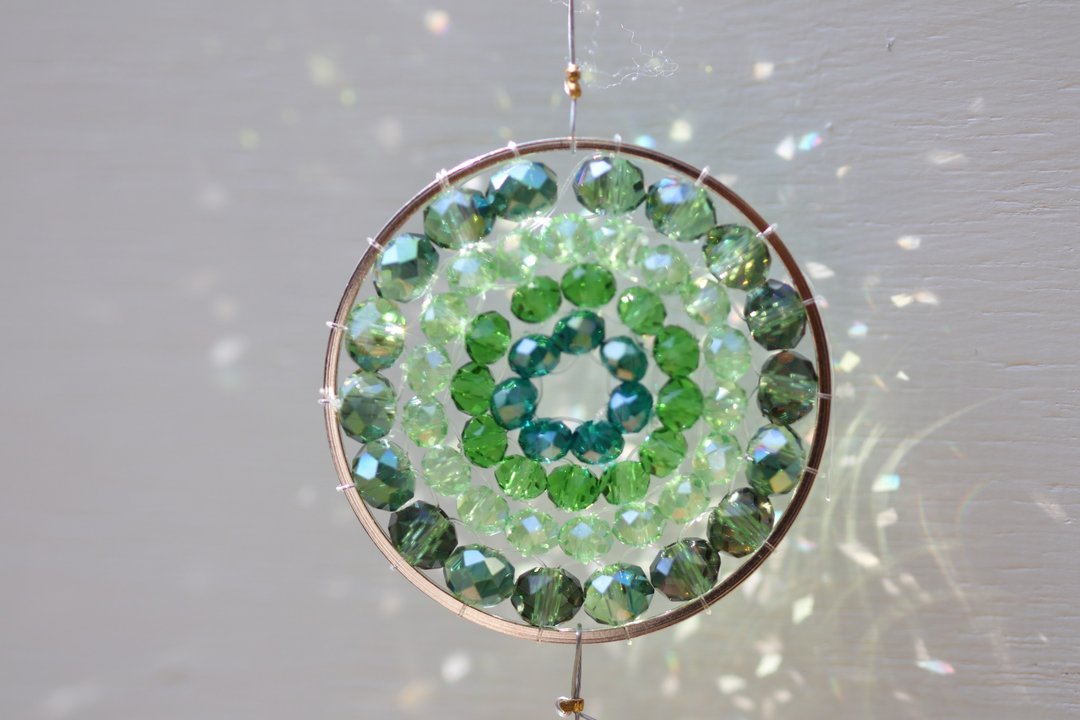 A shining green color mandala made of glass beads. - 其他 - 玻璃 绿色