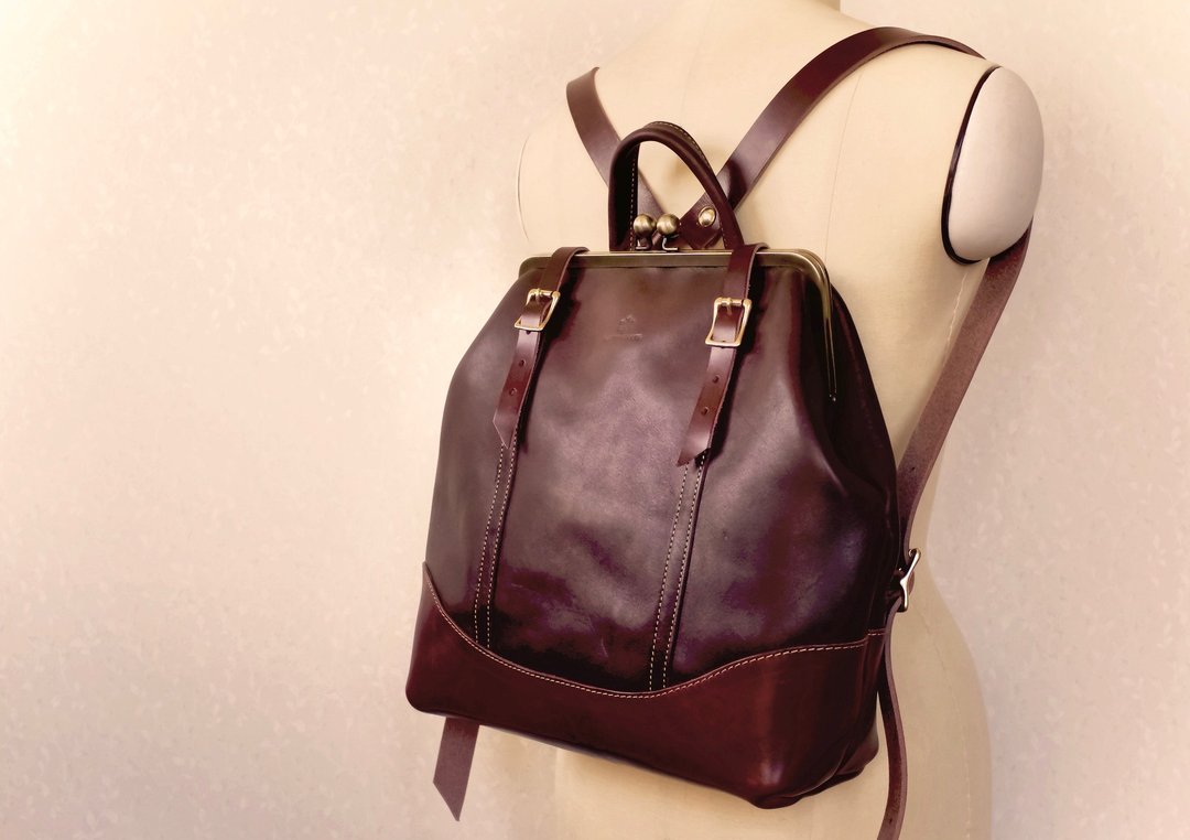 Tochigi leather Gamaguchi Nume leather rucksack ruotare M Bitter Brown - 束口袋双肩包 - 真皮 咖啡色